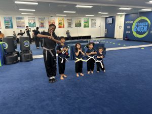 an instructor saluting with her students
