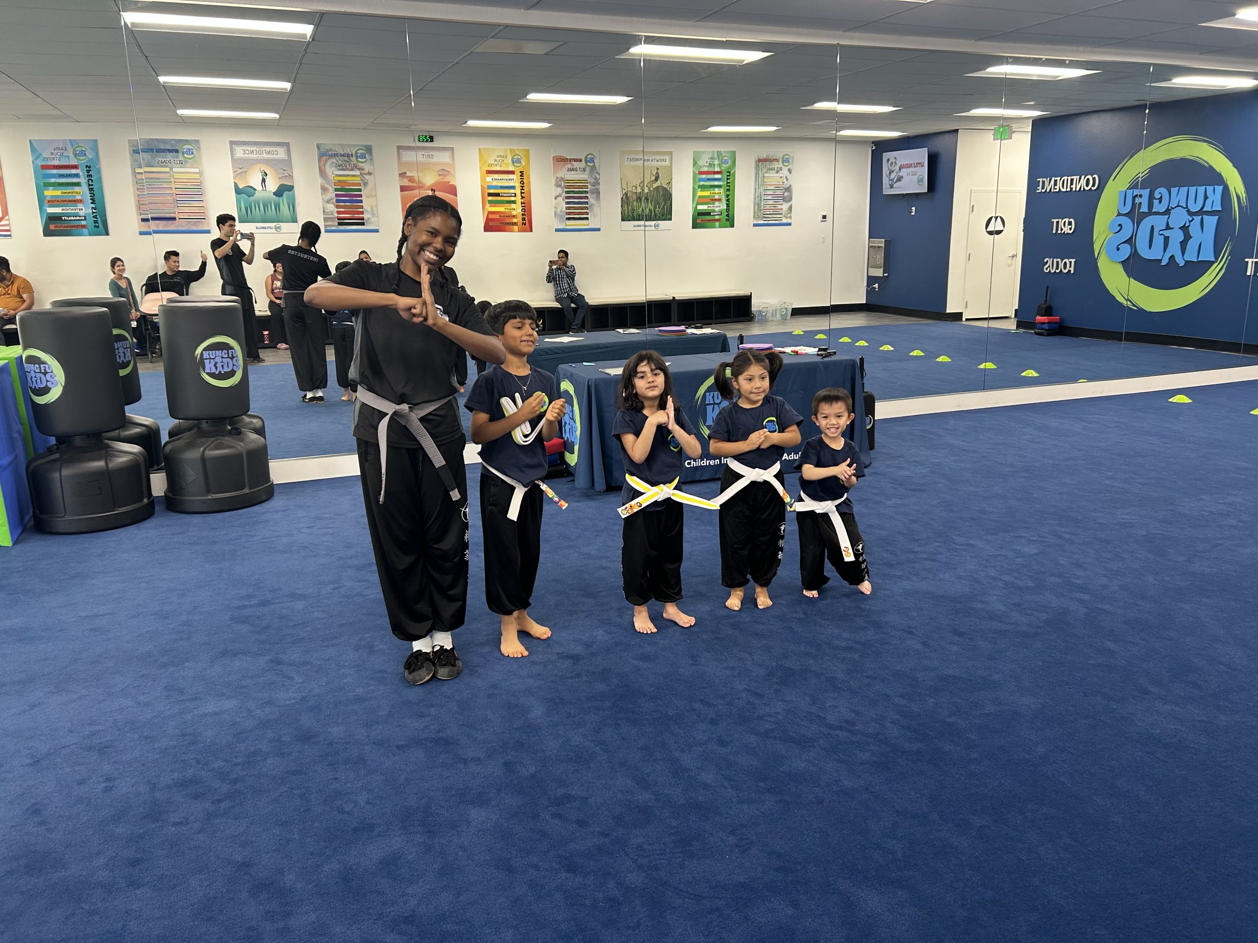 an instructor saluting with her students